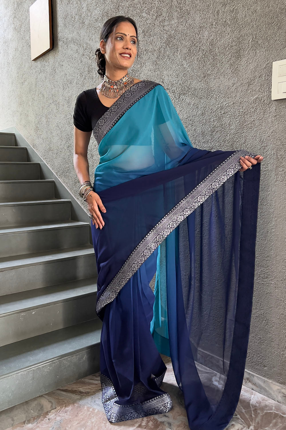 Classy Blue Georgette Saree With Zari Weaving Border